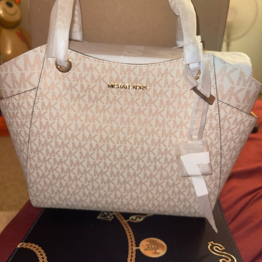 Michael Kors Rose Gold Satchel with Monogram Pattern and Gold Hardware